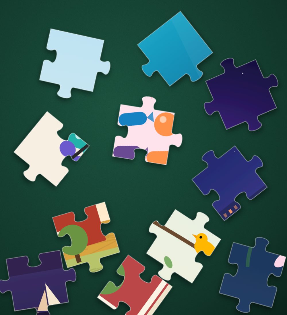 Loose jigsaw pieces on a green felt table
